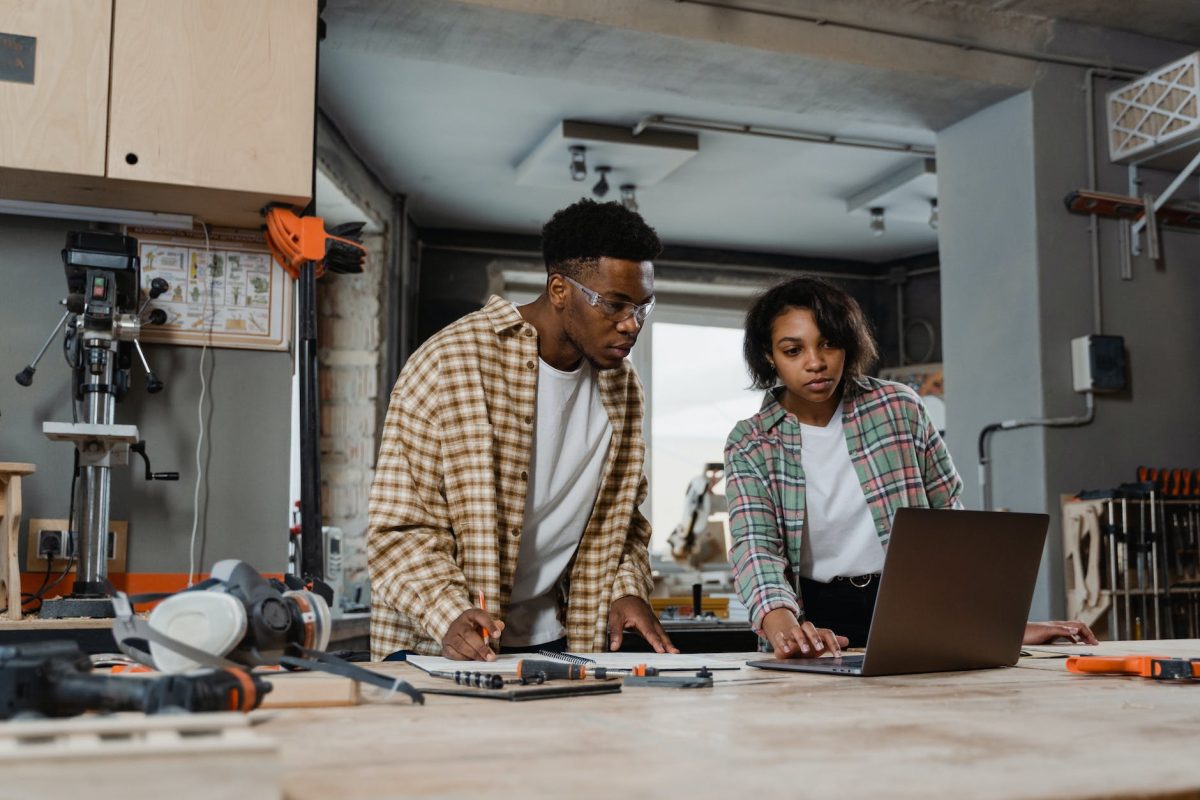 a man and woman doing carpentry